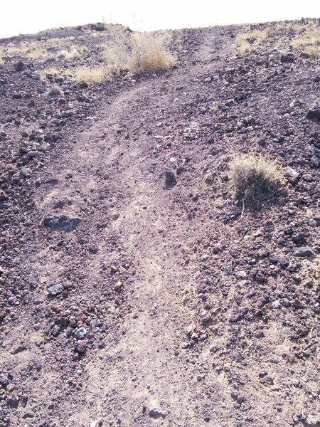 The low cinder cone (?) between Black and Vulcan provides an opportunity to ride on crunchy pumice