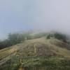 Fog breaking up towards the summit