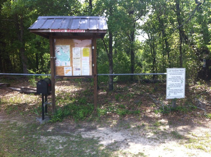 Info sign at trailhead with waiver mailbox