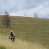 Descending another grassy ridge