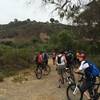 Paved path to dirt trail entrance.