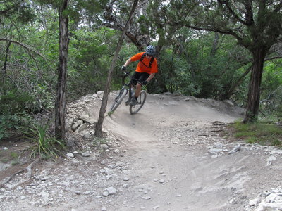 Taylor hitting the berms along the Tangle of Trails Loop