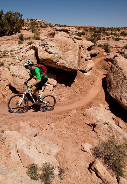 Climbing up through boulders on the southern end of Salt Wash.