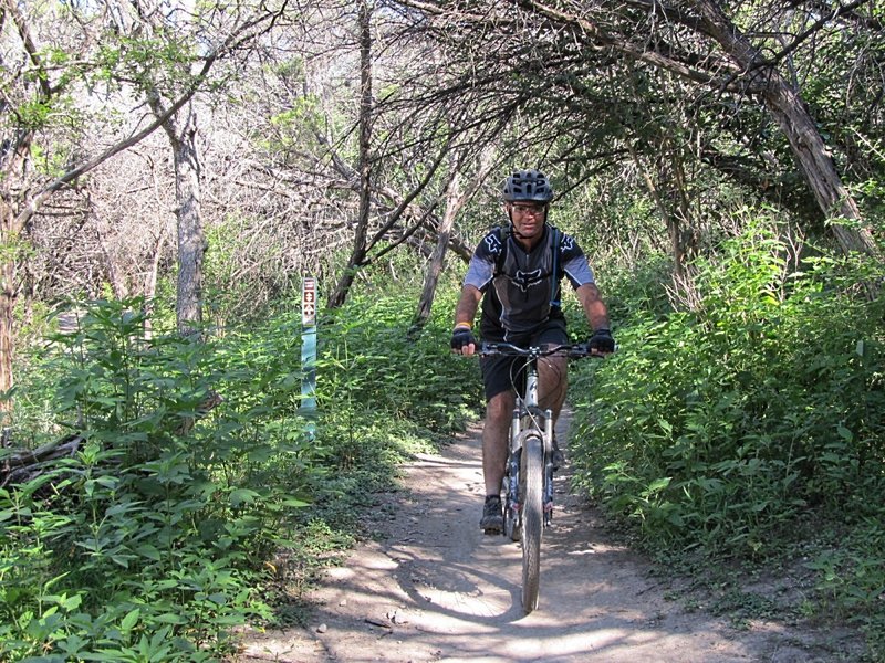 Riding along the bank of the creek on Windy Loop