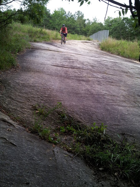 Rider descending Rock Face