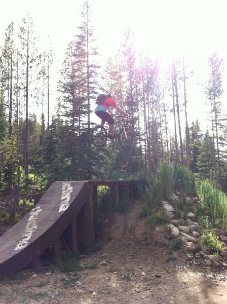 A big wood-to-dirt jump on The Bouldevard at the intersection with Banana Peel, Bear Arms and Space Ape.