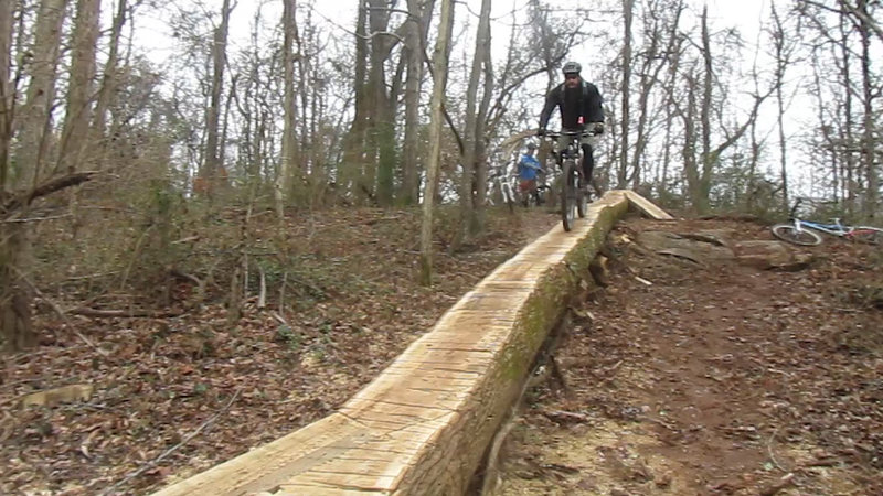 Tom Fitzmaurice rides the repurposed tree debris from the storms of April 2011.