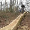 Tom Fitzmaurice rides the repurposed tree debris from the storms of April 2011.