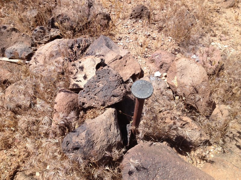 Old (1922) Geological Survey marker denoting township and range boundary.