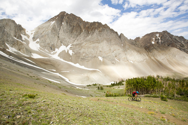 Descending switchbacks below the face of Castle Peak.