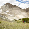 Descending switchbacks below the face of Castle Peak.