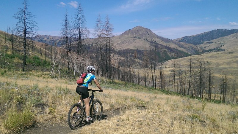 Heading down from the saddle with views of Mahoney Butte