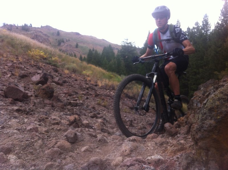 Crossing some lava rock features on Oregon - Fox Connector.