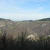 Vista dal Montagnana verso nord: a destra Monte Croce, a sinistra Monte Cassio e dietro in lontananza le Alpi (View north from Mt. Montagnana: right Mt.Croce, left Mt.Cassio and far behind the Alps)