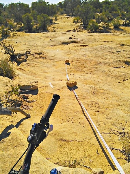 Moab-style paint arrows guide the rider across slickrock areas