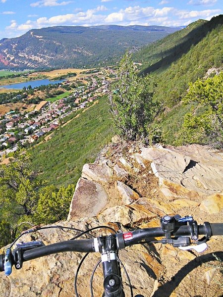 At this point on the trail it is a good idea to hang a hard right. Most of the exposure is psychological. You would have to work fairly hard to go off the trail but definitely intimindating for less experienced riders.