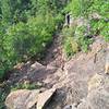 The initial plunge into the gorge is quite steep and rocky, with bedrock steps and water bars