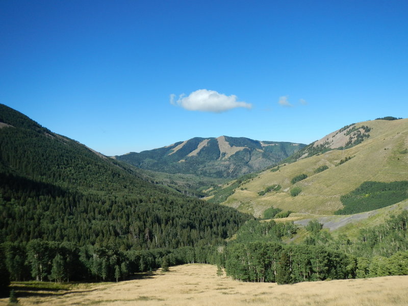 The descent on North Creek Road affords views of a spectacular alpine valley.