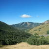 The descent on North Creek Road affords views of a spectacular alpine valley.