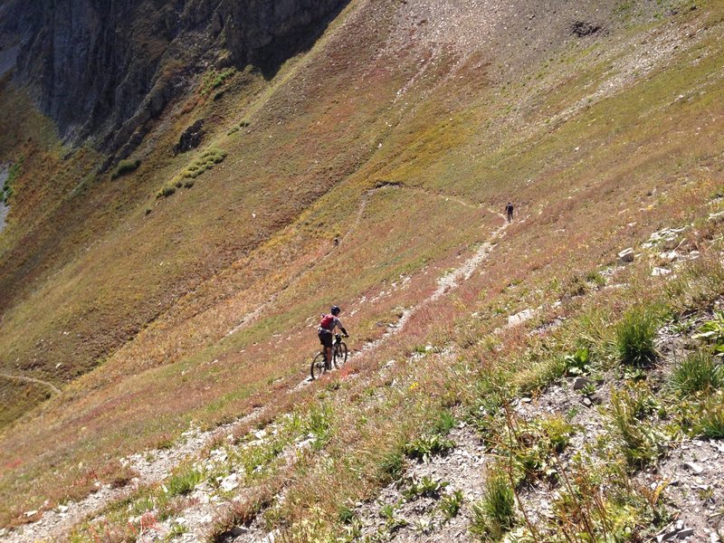 Riders descending from Sharkstooth Pass toward Bear Creek Drainage.