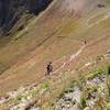 Riders descending from Sharkstooth Pass toward Bear Creek Drainage.