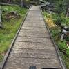 The US Forest Service often calls this a puncheon - it's one of several on this trail. A few of these are dicey to ride - watch for broken boards and nails popping out.