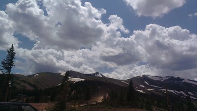 Peak 9 Access Road from restaurant-Wheeler Trail crosses ridgeline in the distance