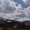 Peak 9 Access Road from restaurant-Wheeler Trail crosses ridgeline in the distance