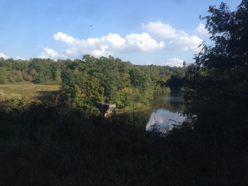 The doubletrack section begins here by crossing a large earthen dam.  The "trail" (actually a dirt road) is to the left of the picture.