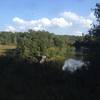 The doubletrack section begins here by crossing a large earthen dam.  The "trail" (actually a dirt road) is to the left of the picture.