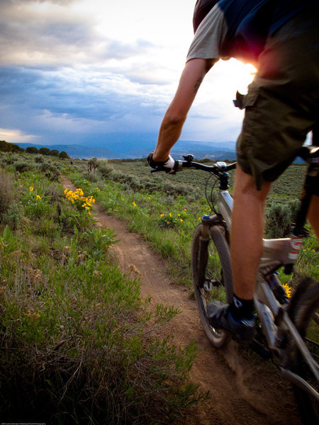 Scott Fleming rides the upper meadow of Boneyard at sunset.