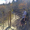 The loose rocks and babyheads on the climb are done when you hit this gate.