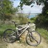 An old hiking trail marker with a scenic view of Lake Georgetown