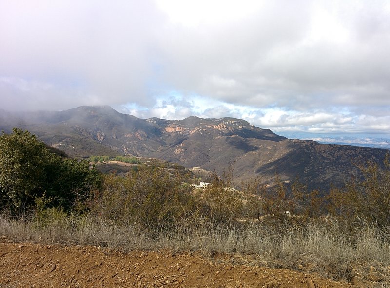 Looking north west (from Backbone Trail: Encinal Canyon) just as the fog is clearing up. Echo Cliffs appear in the background. They are part of Circle X Ranch.