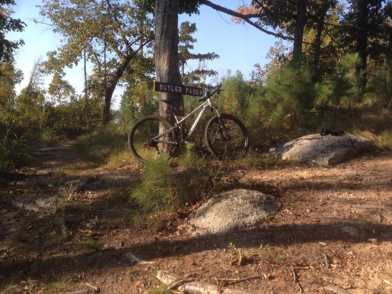 Intersection of Butler Pass and Moonshine Trails.  You can see the lake when standing on the rock with the gloves on it in the picture.