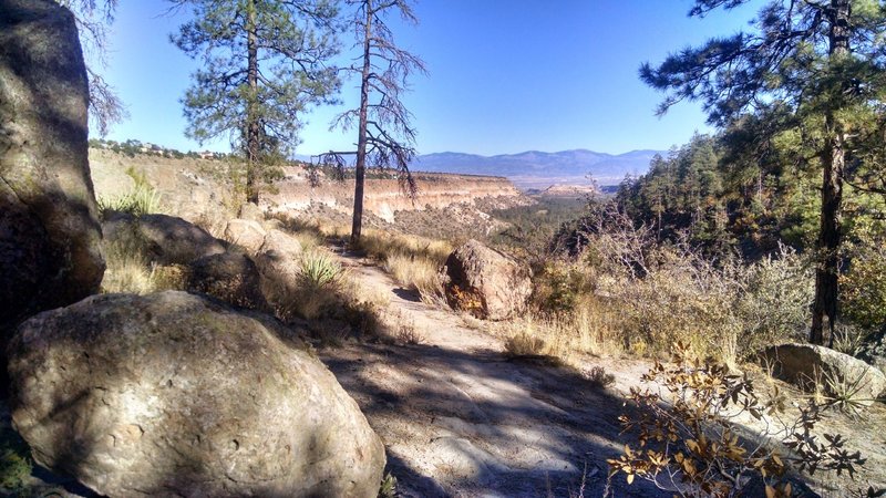 View down Pueblo Canyon, across the Rio Grande Valley to the Sangre de Cristo Mountains.