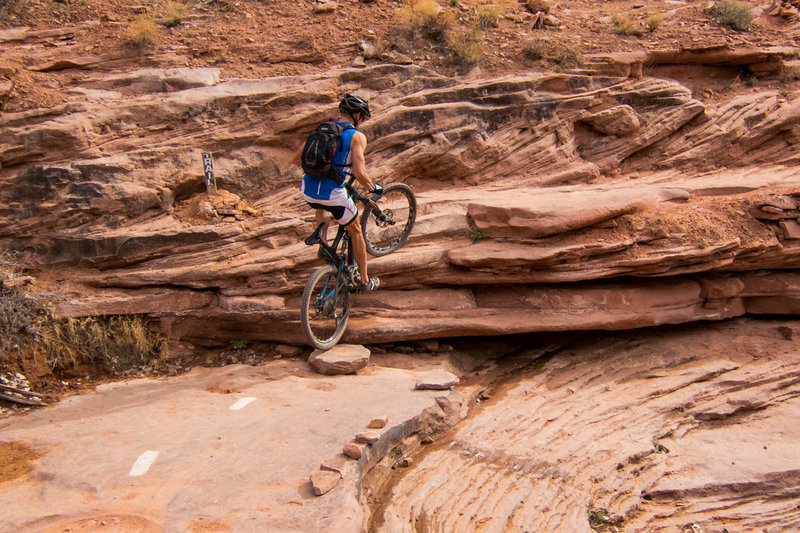 Tricky ledge step-up in the basin of the creek wash.