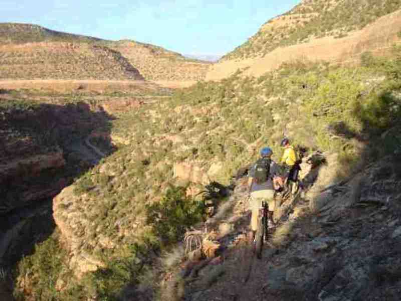 Riding the narrow bench high above the San Miguel River.