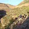 Riding the narrow bench high above the San Miguel River.