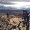 Nearing the top of the Ridge from the counter-clockwise approach. Stunning view of the Las Vegas skyline and valley are off to the rider's right.