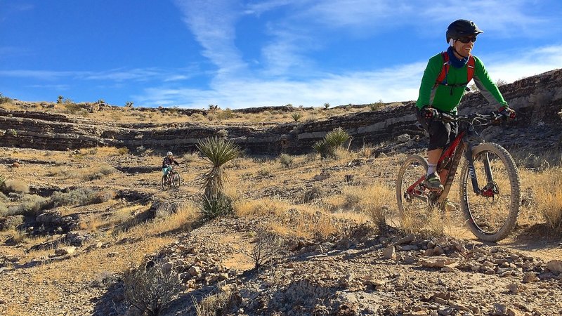 Arena-like rock formations add a feeling of isolation and dramatics to the SW Ridge Trail ride.