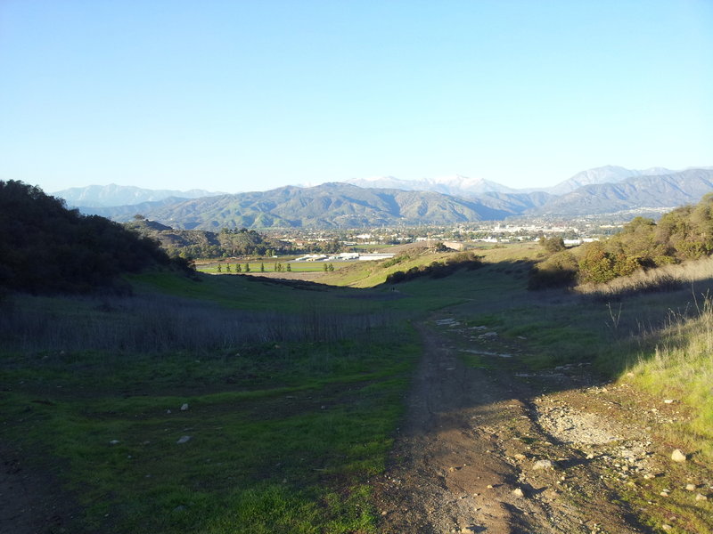 Looking down the hill towards Brackett Field (airport). Corkscrew trail just visible on the left.