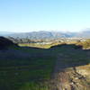 Looking down the hill towards Brackett Field (airport). Corkscrew trail just visible on the left.