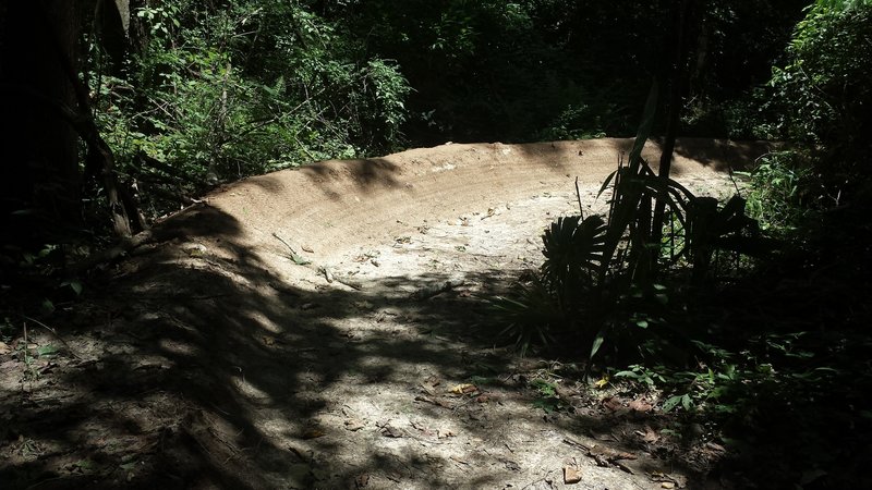 Huge 180° berm at the bottom of a quick descent.