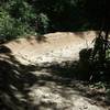 Huge 180° berm at the bottom of a quick descent.