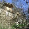 Scenic overhanging rocks and park benches along the pack gravel section of North San Gabriel River Trail