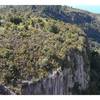 Aerial view of the cliffs at the end of the Waihaha Mountain Bike trail, showing Waihaha Bay and the Waihaha River