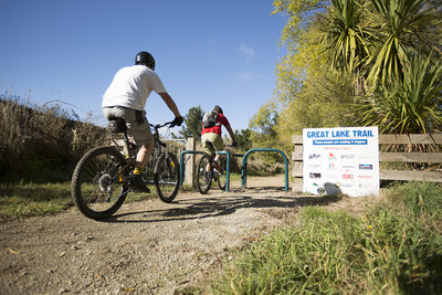Passing through the squeeze gate at the start of the Orakau mountain bike trail