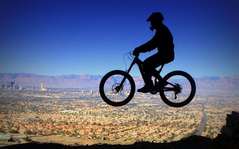 Gap jump #4 on Frenchman's Freeride overlooking Las Vegas valley