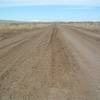 Take care when considering using the roads here. If the skies open up with rain or snow while you are in the area they can become impassable with mud. This is a shot of the road in a dry condition, but the ruts here will give you some idea of what happens when things are more damp.